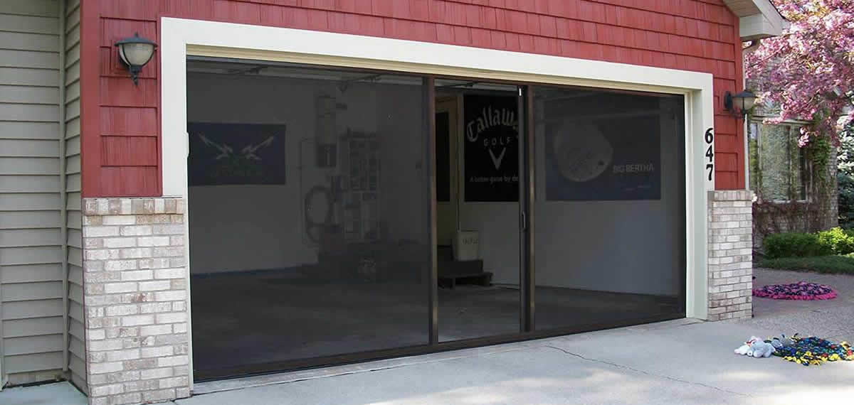 Lifestyle manual garage screen with retractable walk-through door